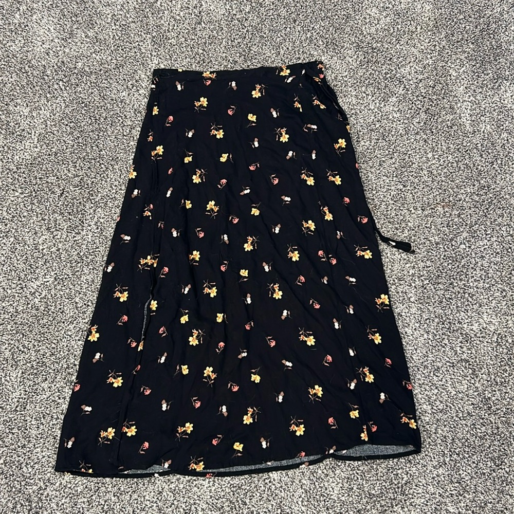 cute black, floral skirt. Super flow-ey. length is about knee/calf length.
